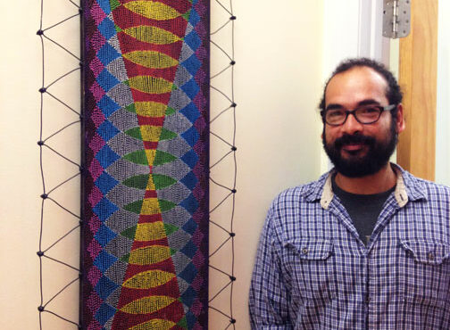 Victor Palomino with his artwork