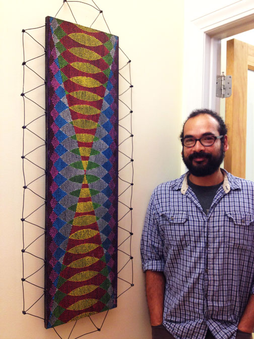 Victor Palomino with his artwork